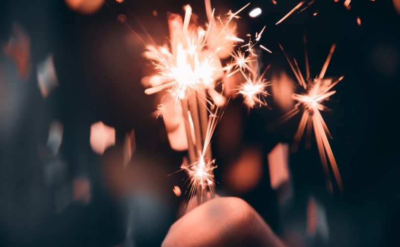 Sparkler in person's hand for New Year